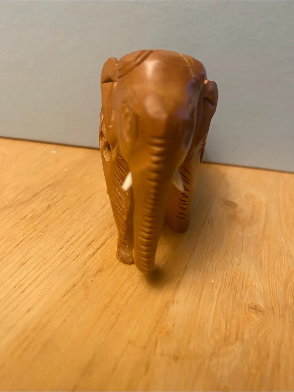 Hand-Carved Wooden Elephant Figurine in Warm Brown with baby elephant in stomach